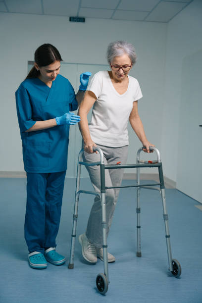 istock Young nurse accompanies an elderly lady in clinic 1483306060