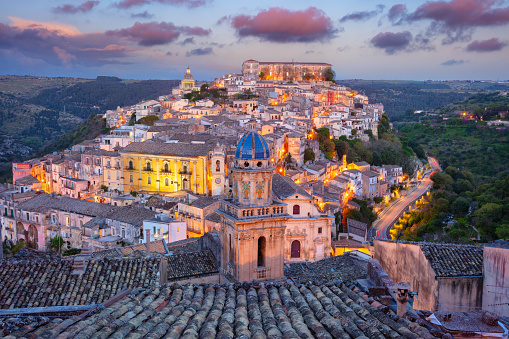 Cityscape image of historical town Ragusa Isla, Sicily at sunset.