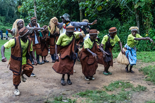 Rushaga, Bwindi Impenetrable Forest National Park, Uganda - March 24, 2023: Batwa pygmies tribe people performing a traditional dance