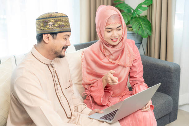 istock Millennial Muslim Spouses Using Laptop Computer Shopping Online at home, Technology Concept 1483310919