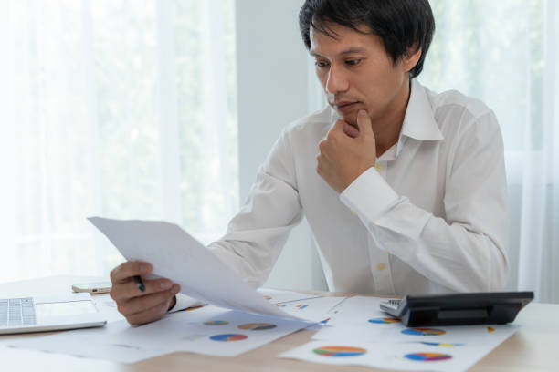 istock Business men calculate benefit, spreadsheets, graph financial development, bank accounts, statistics, economy, data analysis, investment analysis, stock exchange,Interest rates, income 1483311272