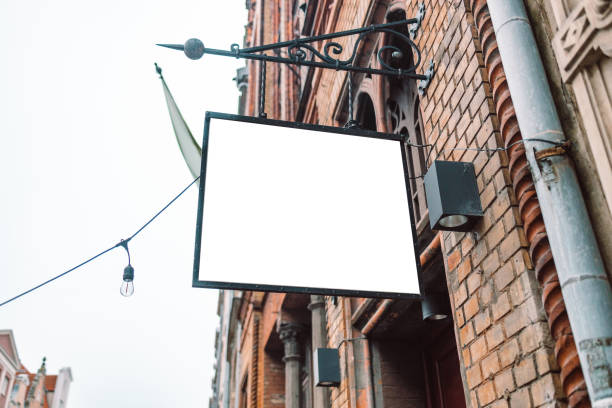 istock Blank billboard mockup for advertising. Blank billboard ready for new advertisement hanging at the building with city street background 1483312180