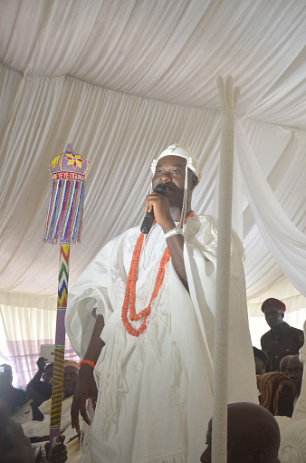 Ile-Ife, Osun State, Nigeria - December 6th, 2015: Oba Adeyeye Enitan Ogunwusi makes his first speech as Ooni of Ife during his installation ceremony.

Oba Enitan Ogunwusi was anointed among other illustrious sons of Ile-Ife on October 26, 2015, as the 51st Ooni of Ife and afterward received his staff of office. Described as an “astute entrepreneur driven by the need to turn impossibilities into possibilities”, he is the intermediary between the gods and the people, not only in the country but also the world over, and of course during annual festivals.