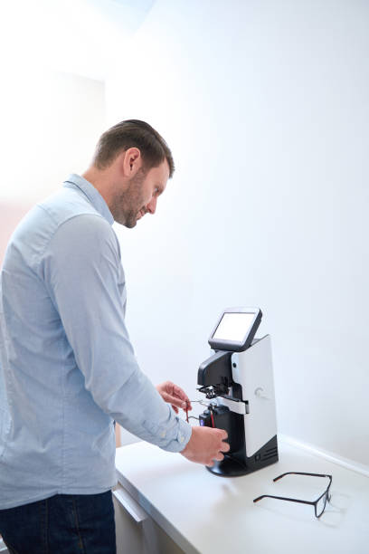 istock Confident optometrist is installing lenses on the frame on the modern machine 1483314310
