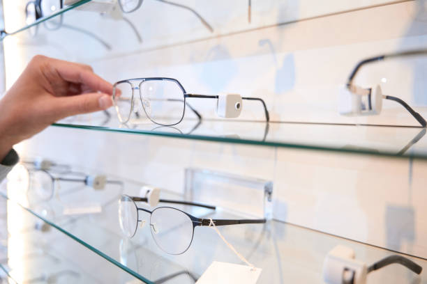 istock Unrecognized person is getting luxury optician frame in the store 1483314330