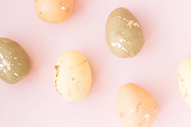 istock Easter eggs of different colors on a pink background 1483314425