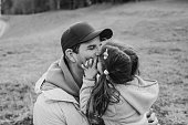 Happy father having tender moment with little daughter during trekking day in the mountain - Family love concept