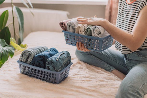 istock Lady organized her clothes into containers 1483315286