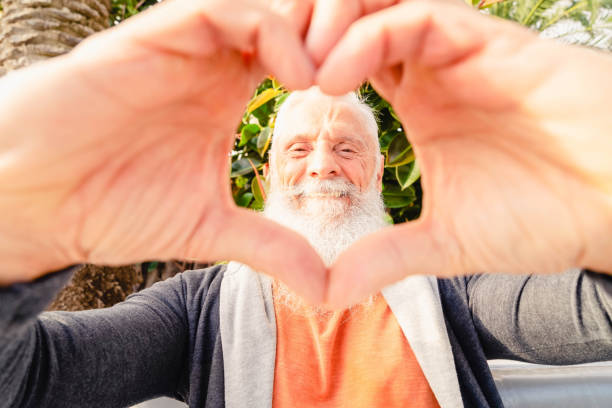 istock Smeling senior man with heart 1483317271