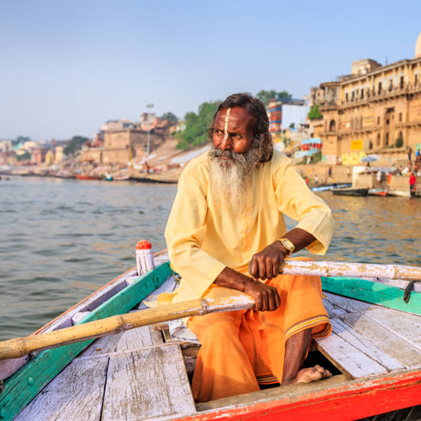 istock Sadhu rowing boat on the holy Ganges River in Varanasi 1483318966