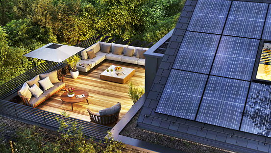Modern house with roof terrace and solar panels