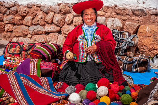 Chinchero, Peru - September 20, 2015: Unidentified women with the traditional clothes in Chinchero market on September 20, 2015 in Peru.