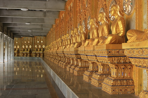 Row of Golden Buddha statue in Roi-Et Thailand, Beautiful golden Buddha statues