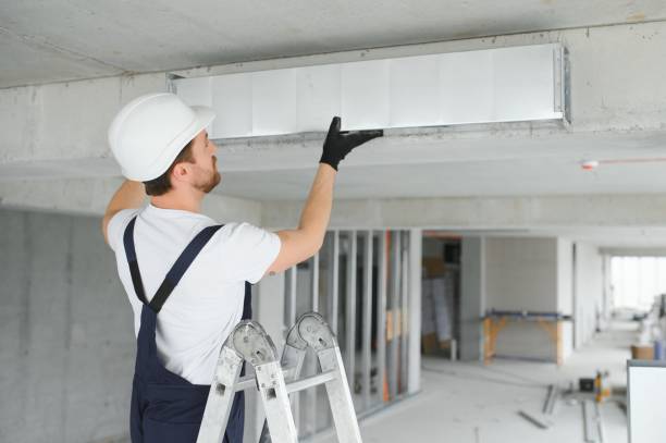 istock hvac services - worker install ducted pipe system for ventilation and air conditioning 1483322832