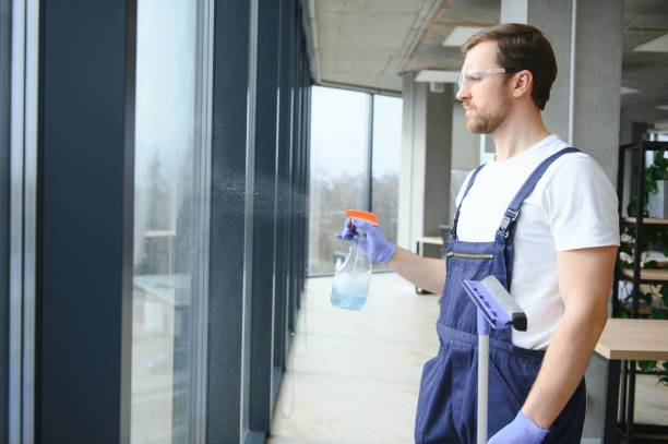 istock Male worker washing window glass 1483323196