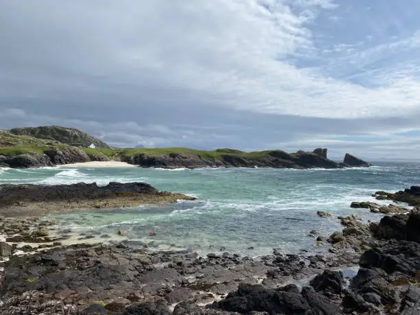 Amazing Clachtoll Beach in Lochinver, Scotland. Clachtoll Beach is a popular beach with some rugged terrain, including the Split Rocks