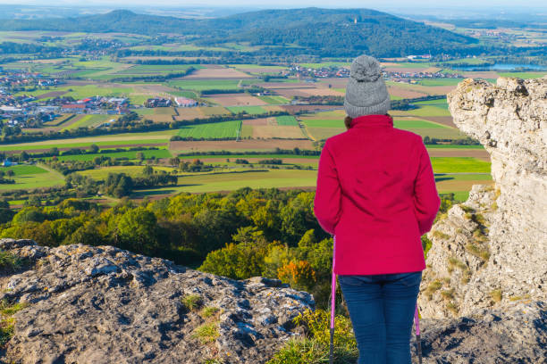 Female trekker on rock of Bad Staffelstein Germany Trekking Franconia Bavaria lichtenfels stock pictures, royalty-free photos & images