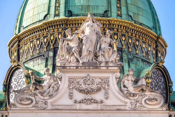 Dome of St. Michael's Wing, Hofburg, Vienna Gilded bronze cupola with marble statues of Michaelertrakt of St. Michael's square exterior facade of Hofburg Imperial palace in Vienna constructed in 1889-1893 the hofburg complex stock pictures, royalty-free photos & images