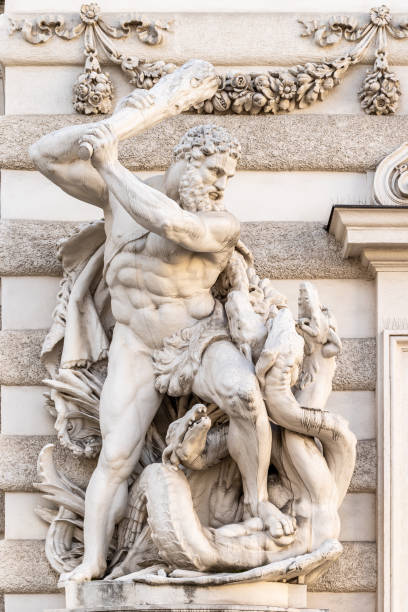 Hercules and Hydra statue in Vienna Heracles and the Lernaean Hydra marble statue unveiled in 1893 by Austrian sculptor Edmund Hofmann von Aspernburg (1847-1930) on Michael square in Vienna mythological character stock pictures, royalty-free photos & images
