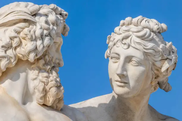 Close-up head shots of white marble allegorical figures of rivers Inn and Danube unveiled in 1902 by Austrian sculptor Hugo Haerdtl (1846-1918) as part of Pallas Athene fountain on Vienna Ring Road, Ringstrasse