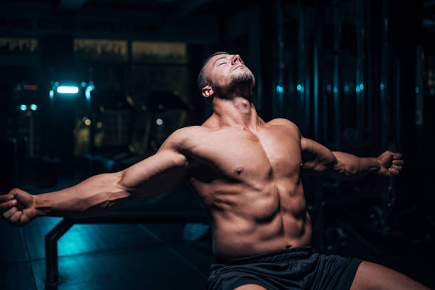 istock Male body builder sitting in gym 1483328746