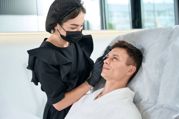istock Client in beauty clinic getting injection procedures 1483330697