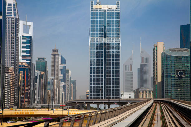 istock Modern skyscrapers along the metro line in Dubai, UAE 1483330769