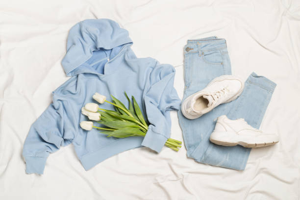 istock Stylish pastel spring outfit on white sheet background, top view 1483331574