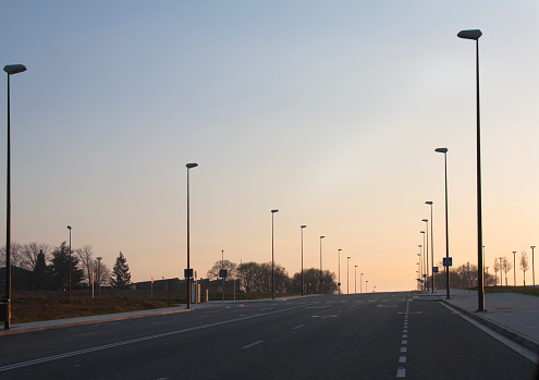 Row of modern street lights, empty avenue at sunset, backgrounds, Galicia, Spain