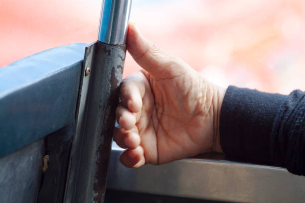 istock Hand of thai mature man in bus 1483340074