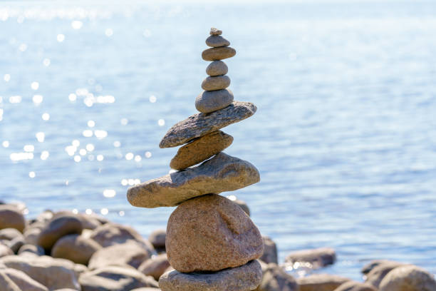 istock Pyramid of stones. Unstable balance of stone objects. 1483340531
