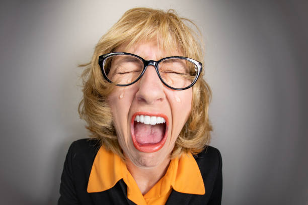 Funny Fisheye Older Woman Having an Ugly Cry A funny fisheye image of an older woman Sobbing like a big baby. ugly people crying stock pictures, royalty-free photos & images