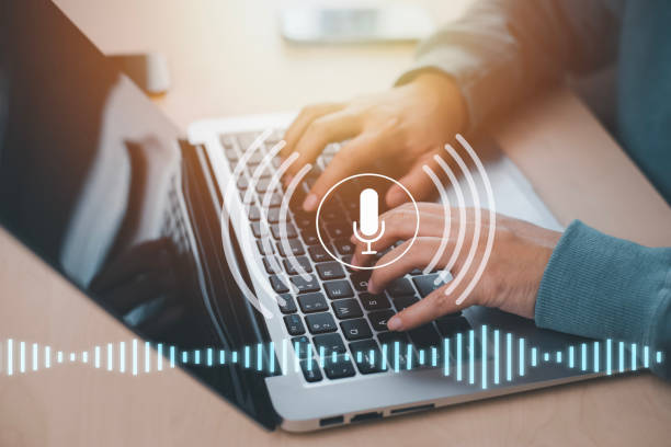istock Businessman using laptop with microphone button on virtual screen. Blog blog speak talk advertising presentation, Voice recognition, speech detection and deep learning application,Voice Assistance 1483354545