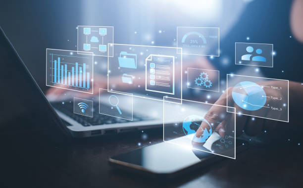 istock Businessman working on laptop and touch screen Online documentation database, IT consultant being set up Virtual Document Management System with laptop,Software for archiving corporate files. 1483354870