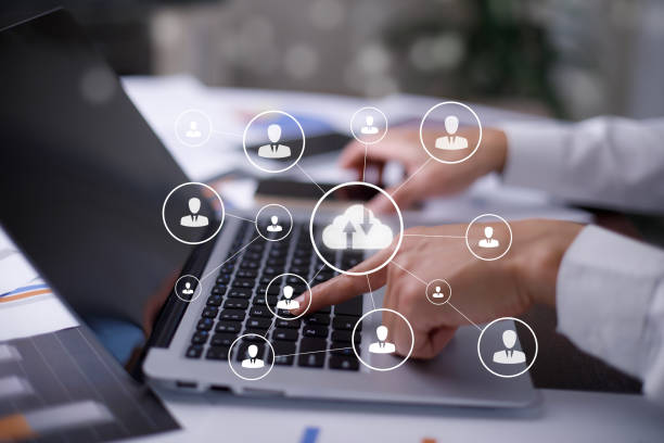 istock Businessman hand holding smartphone and laptop with cloud computing diagram show on hand. Cloud technology. Data storage. Networking and internet service concept, Cloud sharing download and upload 1483355612