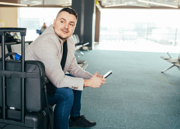istock Male Traveler Waiting for His Flight 1483357114