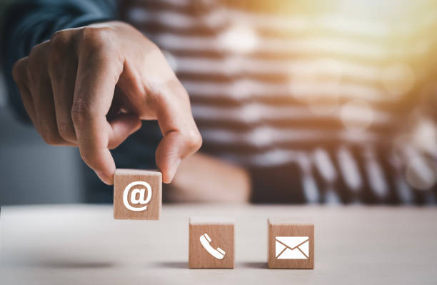istock communication and technology and Cloud concept , Hand putting wooden block cube symbol telephone, email, address. Website page contact us or e-mail marketing, Contact us in customer support concept 1483357775