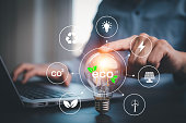 Business people touch the light bulbs with virtual modern reduce CO2 emission concept with icons, Sustainable development, and business based on renewable energy. Reduce co2 emission, global warming