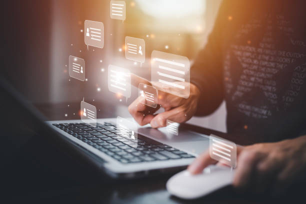 istock Businessman hold Laptop and touch Chat bot Chat with AI, Artificial Intelligence, System Artificial intelligence an artificial intelligence chatbot, Digital chatbot, Robot application, conversation 1483359422