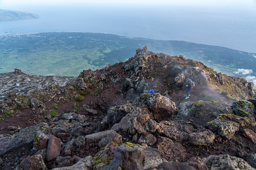 Sunrise on the top of  highest mountain in Portugal, the volcano Pico, smoke coming out of volcano, Azores