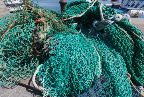 Fishing nets in large plastic pots at the port in Savudria, Croatia