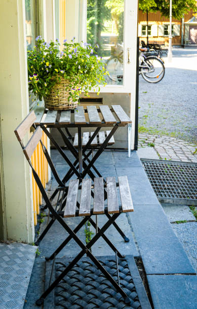 istock Outdoors chairs and table in front of a house 1483361520