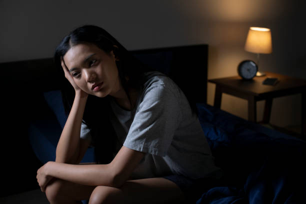 istock Depressed young Asian woman can not sleep from insomnia 1483361636