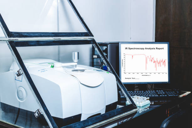 Fourier Transform Infrared Spectroscopy FTIR Instrument and IR spectrum shown on monitor. Fourier Transform Infrared Spectroscopy FTIR Instrument with the IR spectrum of sample was analysed as shown on the monitor. FTIR was used to identify the chemical identity of drug or sample analysed fourier stock pictures, royalty-free photos & images