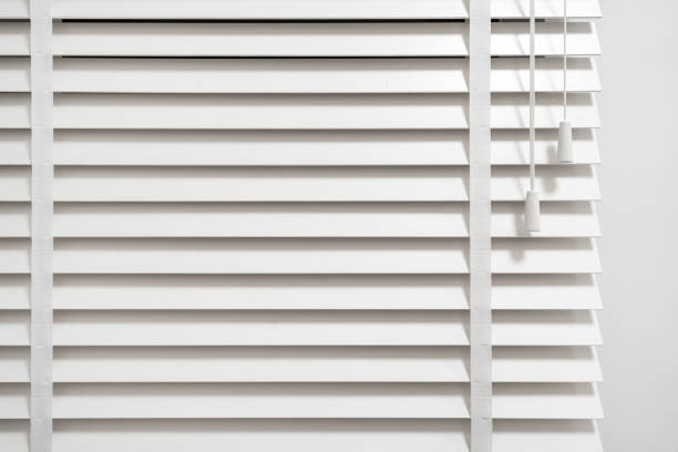 istock Window blinds with vertical wooden slats in room 1483366180