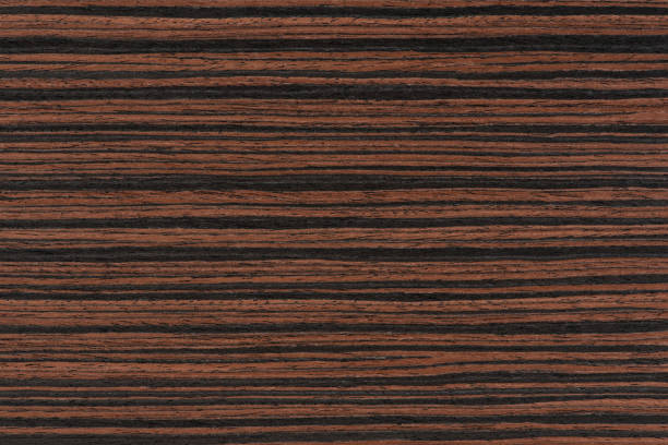 istock Macassar wood texture. High quality red and brown macassar wood plank surface texture. The texture of hard and heavy wood, with a beautiful surface for the production of furniture or flooring 1483368284