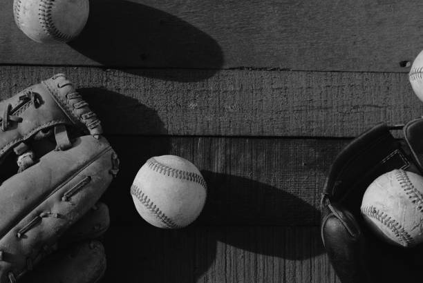 istock Old wood background with baseball equipment in black and white 1483372269