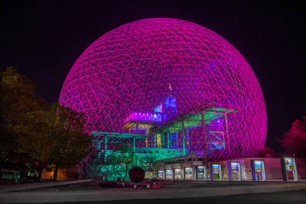 Night view of The Biosphere Environment Museum illuminated in blue light in Montreal. Montreal, Canada - October 29, 2025.