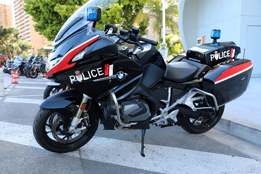 Monte-Carlo, Monaco - April 16, 2023: Side view of two impressive BMW R 1250 RT motorcycles, part of Monaco's police force, parked on a street in Monte Carlo, Monaco