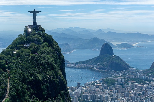 the iconic Rio de Janeiro skyline, with the world-famous Christ the Redeemer statue in the foreground